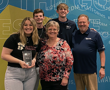 WNZR staff celebrate University Station of the Year award