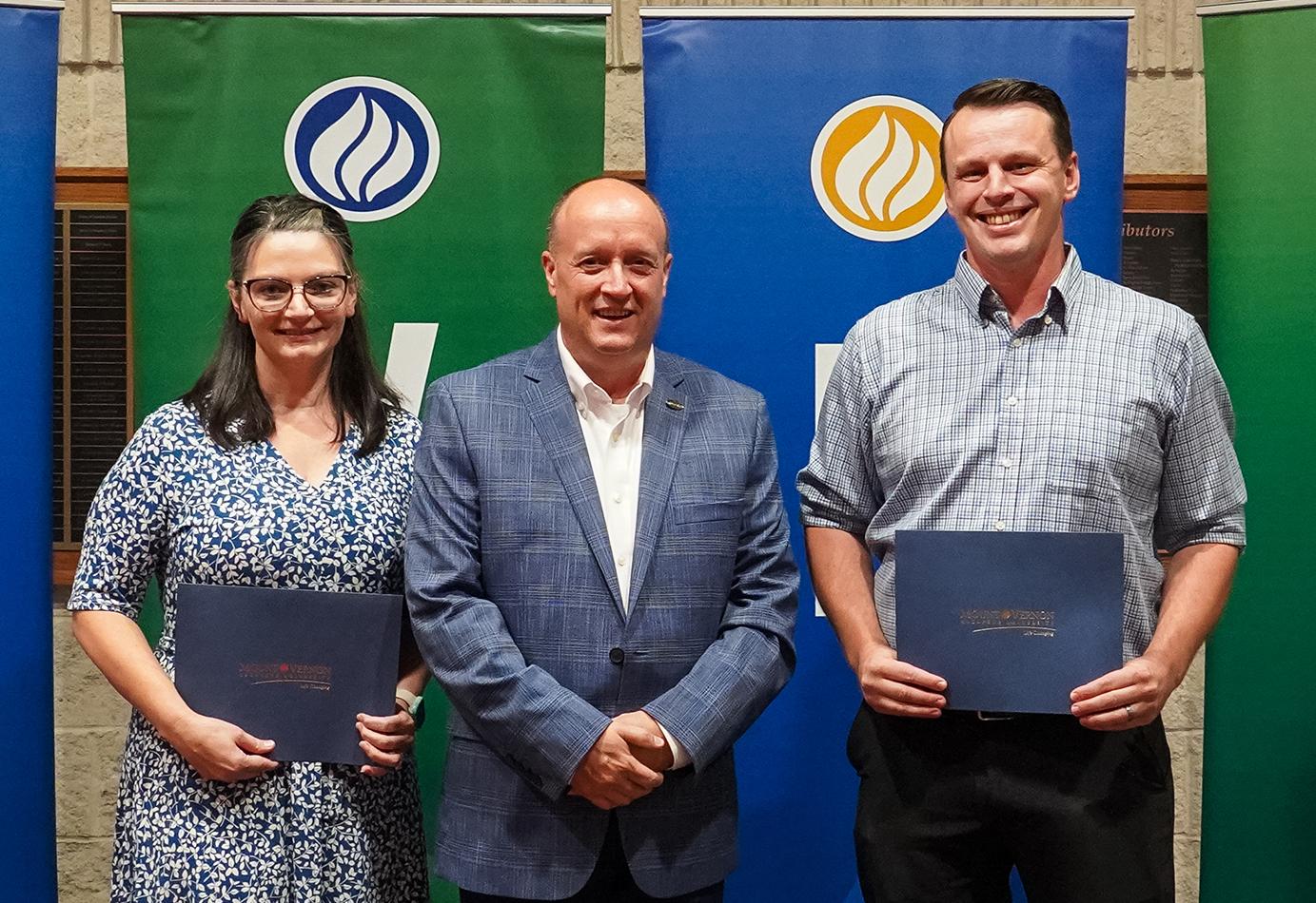 Mount Vernon Nazarene University President Dr. Carson Castleman, center, congratulates Excellence In the Call award recipients Lisa Mentzer, Assistant Accreditation Coordinator, left; and Michael Simmons, Assistant Director of Academic and Registration Services, right. 