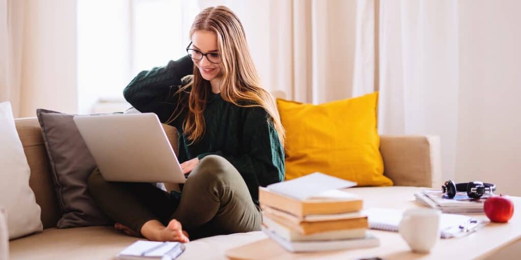 A woman studying in her living room