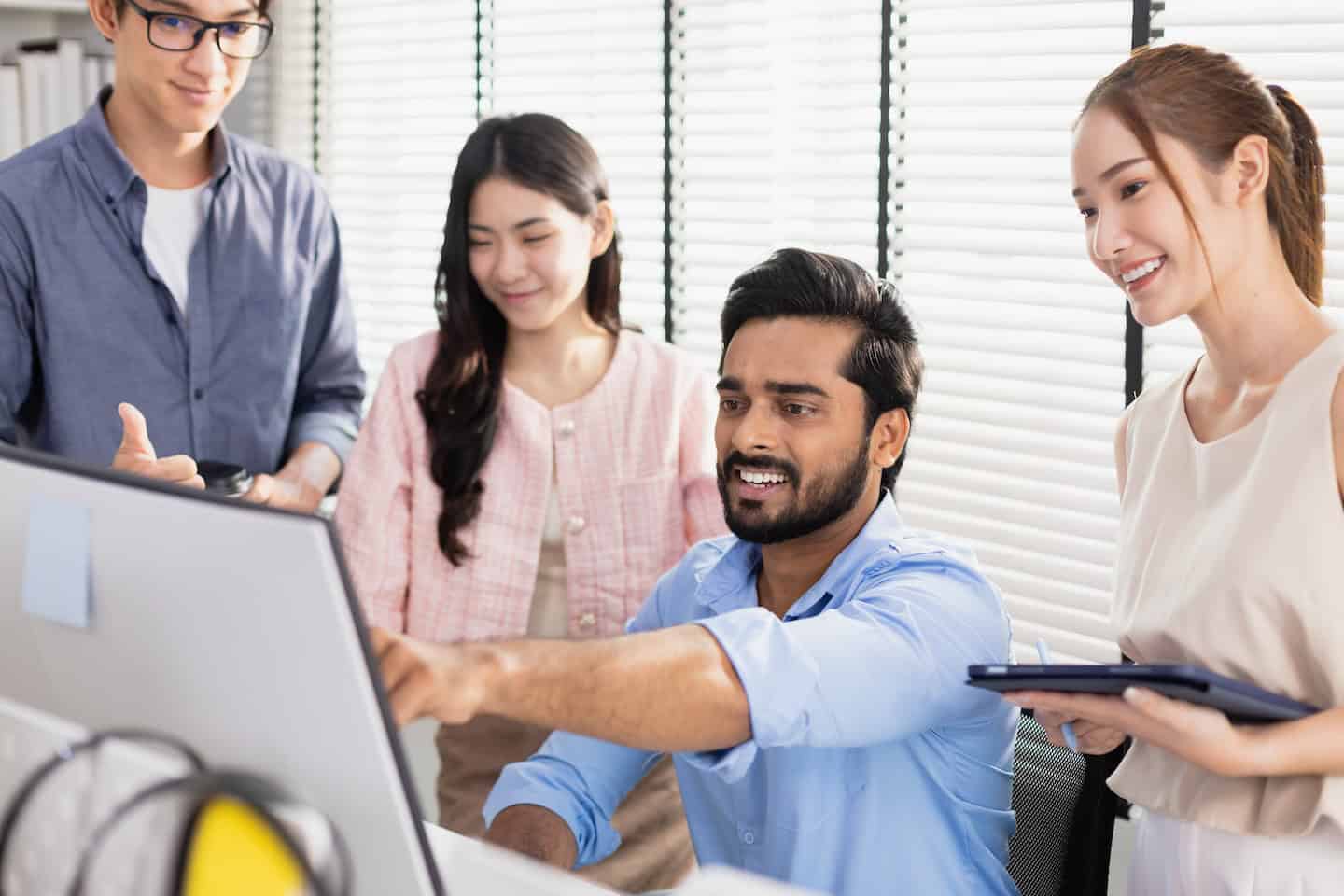 Business teamwork brainstorming strategy marketing planning. Male manager presentation with computer for female worker inside office listens to meeting report project.