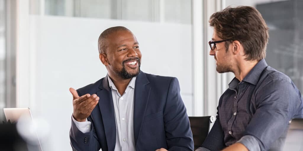 An employer interviewing a potential candidate to verify their employability.
