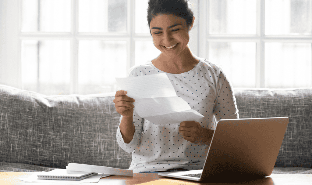 Woman reviews her financial aid options and scholarships for her online courses at MVNU.