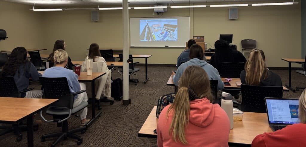 Mount Vernon Nazarene University Assistant Professor of Nursing Esther Rudolph, not shown, demonstrates the new SimX Virtual Reality software to one of her classes this semester. The software, when paired with a Meta Quest VR headset, is changing the way students prepare for real life situations in a classroom setting. (Photo courtesy of Mount Vernon Nazarene University)