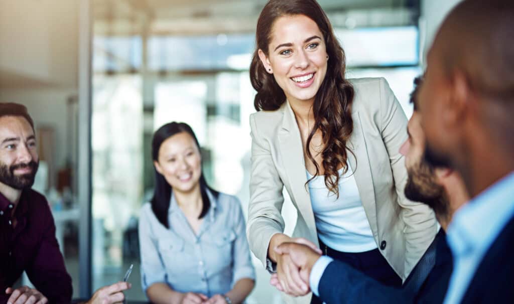 Young professional connecting with colleagues, symbolizing a career with a purpose.