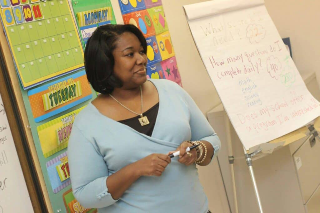 Teacher leading a classroom lesson, highlighting the hands-on impact of an online teaching degree in Cincinnati.