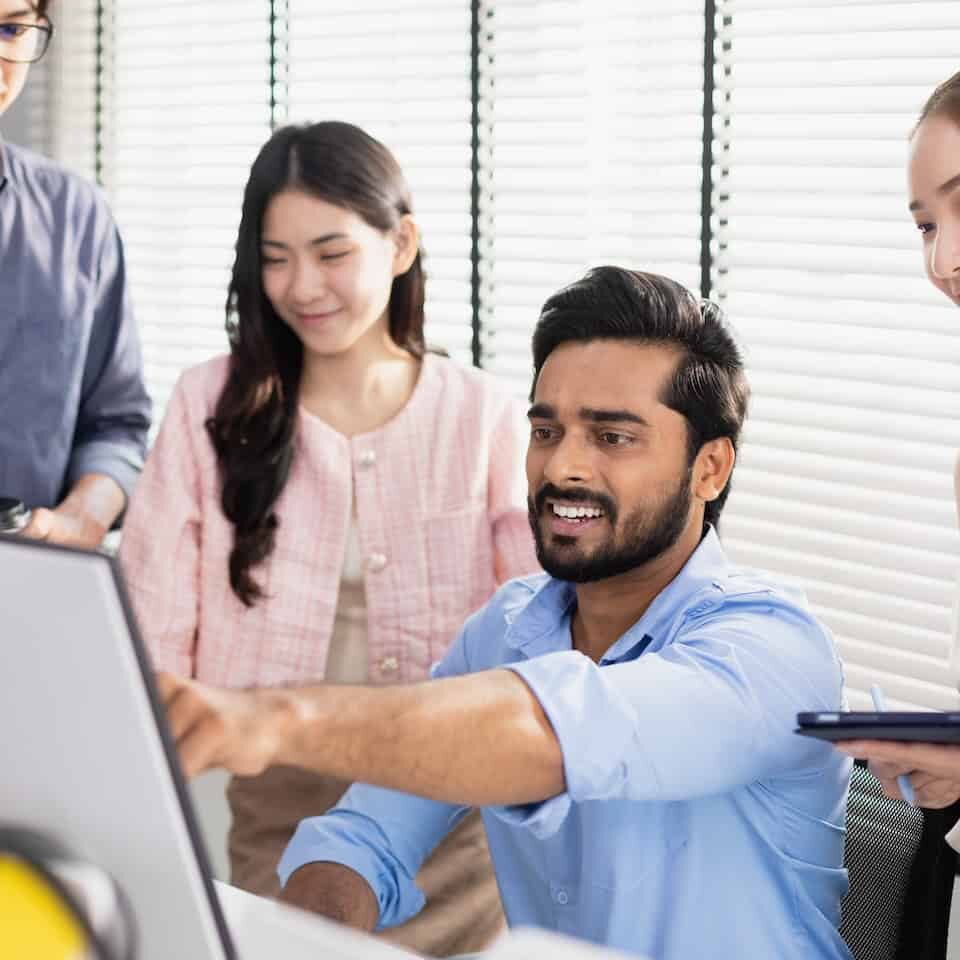 Business teamwork brainstorming strategy marketing planning. Male manager presentation with computer for female worker inside office listens to meeting report project.